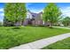 Charming two-story brick home featuring a well-manicured lawn and mature trees at 5942 Tioga Ct, Bargersville, IN 46106