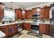 Cozy kitchen with stainless steel appliances and tile flooring at 5942 Tioga Ct, Bargersville, IN 46106
