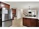 Kitchen with stainless steel appliances and dark wood cabinets at 5942 Tioga Ct, Bargersville, IN 46106
