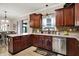 Spacious kitchen with stainless steel appliances and views into dining area at 5942 Tioga Ct, Bargersville, IN 46106