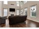 Bright living room with fireplace, mounted TV, and two sofas at 5942 Tioga Ct, Bargersville, IN 46106