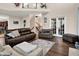 Open concept living room with hardwood floors and a cozy seating area at 5942 Tioga Ct, Bargersville, IN 46106