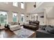 Living room with large windows, wood flooring, and two sofas at 5942 Tioga Ct, Bargersville, IN 46106