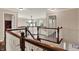 Spacious loft with railing, wood floors, and view to the outside through three large windows at 5942 Tioga Ct, Bargersville, IN 46106