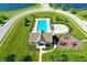 Aerial view of the community pool with ample seating, a splash pool and playground, providing residents with recreational amenities at 5942 Tioga Ct, Bargersville, IN 46106