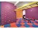 This recreation room has a climbing wall, monkey bars, and exercise equipment at 5942 Tioga Ct, Bargersville, IN 46106