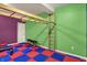 Brightly colored recreation room includes climbing wall, monkey bars, and space for fitness at 5942 Tioga Ct, Bargersville, IN 46106