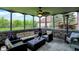 Inviting screened porch with comfortable wicker seating, a ceiling fan, and a backyard view at 5942 Tioga Ct, Bargersville, IN 46106