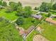 Wide aerial view of the property featuring a green lawn, garden, and outbuildings, offering a peaceful retreat at 5987 E 100 N, Franklin, IN 46131