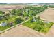 Aerial view of rural property near fields with multiple single Gathering homes at 5987 E 100 N, Franklin, IN 46131