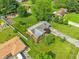 Aerial view showcasing a charming brick home with lush landscaping and a spacious, well-kept yard at 5987 E 100 N, Franklin, IN 46131