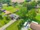 Sprawling property featuring mature trees, large lawn, detached garage, camper parking and a well-maintained single-Gathering home at 5987 E 100 N, Franklin, IN 46131