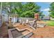 Charming backyard featuring a comfortable seating area, garden beds, and a playhouse for outdoor enjoyment at 5987 E 100 N, Franklin, IN 46131