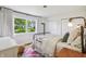 Cozy bedroom featuring a large window with lush outdoor views and a comfortable bed at 5987 E 100 N, Franklin, IN 46131