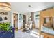 Bright bedroom featuring a wooden bunk bed, a plush chair, and an organized closet at 5987 E 100 N, Franklin, IN 46131