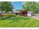 Charming brick home featuring a well-manicured lawn and lush landscaping at 5987 E 100 N, Franklin, IN 46131