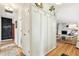 Bright hallway with built-in storage and hardwood floors leading to living area at 5987 E 100 N, Franklin, IN 46131