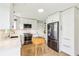 Bright kitchen with white cabinetry, stainless steel appliances, and a butcher block island at 5987 E 100 N, Franklin, IN 46131