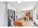 Modern kitchen flows into the dining area, featuring stainless steel appliances and ample cabinetry at 5987 E 100 N, Franklin, IN 46131