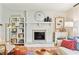 Bright living room featuring a brick fireplace, stylish decor, and cozy seating at 5987 E 100 N, Franklin, IN 46131