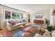 Inviting living room with large window, modern furniture, and hardwood flooring at 5987 E 100 N, Franklin, IN 46131