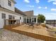 Backyard featuring a well-maintained wooden deck and sunroom at 6086 W 850 S, Edinburgh, IN 46124