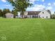 Fenced-in yard featuring outbuilding and mature trees at 6086 W 850 S, Edinburgh, IN 46124