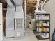 Unfinished basement with mechanicals, water heater, storage shelves and exposed ceiling at 6086 W 850 S, Edinburgh, IN 46124
