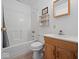 Bathroom with tub-shower combo, wood vanity and white fixtures at 6086 W 850 S, Edinburgh, IN 46124