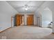 Large bedroom featuring neutral walls, carpet, closet and windows at 6086 W 850 S, Edinburgh, IN 46124
