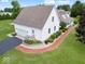 Well-maintained home featuring a brick walkway and attached garage at 6086 W 850 S, Edinburgh, IN 46124
