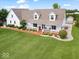 Inviting two-story home with a charming front porch and manicured landscaping at 6086 W 850 S, Edinburgh, IN 46124