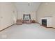 Bright living room features high ceilings, fireplace, large window, and neutral decor at 6086 W 850 S, Edinburgh, IN 46124