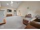 Bright living room featuring vaulted ceilings, carpeting, fireplace and doorway to kitchen at 6086 W 850 S, Edinburgh, IN 46124