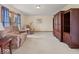 Cozy living room with plush carpeting, comfortable seating, and a large wood entertainment center at 6086 W 850 S, Edinburgh, IN 46124