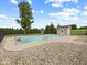 Fenced backyard featuring an in-ground swimming pool and small outbuilding at 6086 W 850 S, Edinburgh, IN 46124