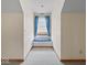 Close-up of window seat with blue cushion and natural light at 6086 W 850 S, Edinburgh, IN 46124