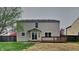 Backyard view showcasing the home's exterior and wooden deck at 6420 Greenspire Pl, Indianapolis, IN 46221