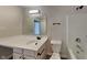 Bathroom featuring a white vanity, toilet, and shower/tub combination at 6420 Greenspire Pl, Indianapolis, IN 46221