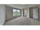 Bedroom featuring neutral carpet, a window, and a closet at 6420 Greenspire Pl, Indianapolis, IN 46221