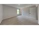 Bedroom featuring neutral carpet, a window, and a closet at 6420 Greenspire Pl, Indianapolis, IN 46221