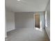 Bedroom featuring neutral carpet and a window at 6420 Greenspire Pl, Indianapolis, IN 46221