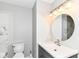 Bathroom featuring vanity with sink, toilet, and decorative wall tile at 6837 W Burlington Dr, McCordsville, IN 46055