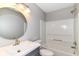 Bathroom with a modern vanity, round mirror, tub, shower, and toilet at 6837 W Burlington Dr, McCordsville, IN 46055