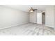 Bedroom with neutral walls, plush carpeting, and a bright window at 6837 W Burlington Dr, McCordsville, IN 46055
