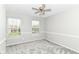 Bedroom features plush carpet, natural light from two windows, and a ceiling fan at 6837 W Burlington Dr, McCordsville, IN 46055