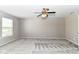 Bedroom featuring neutral walls, plush gray carpeting, and a ceiling fan at 6837 W Burlington Dr, McCordsville, IN 46055