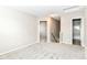 Spacious hallway with neutral walls, carpeting, and access to other rooms at 6837 W Burlington Dr, McCordsville, IN 46055