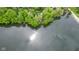 Beautiful aerial view of waterfront home surrounded by lush trees at 7 Lake Hart, Mooresville, IN 46158