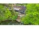 Aerial view of house showing deck, stairs to dock, and lake access at 7 Lake Hart, Mooresville, IN 46158